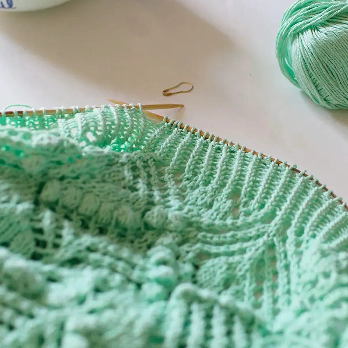 Hand-knitted Komorebi shawl, close-up view