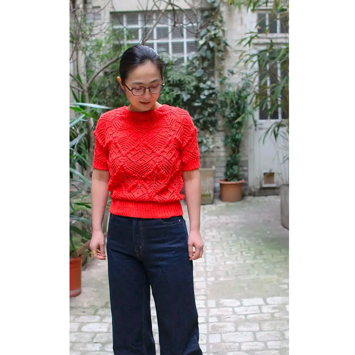 Hand-knitted Komorebi shawl, delicate blue color